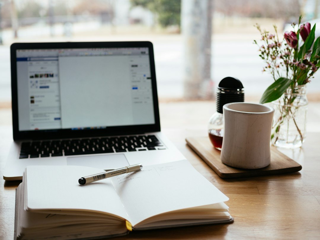 Laptop and notebook representing content marketing and copywriting
